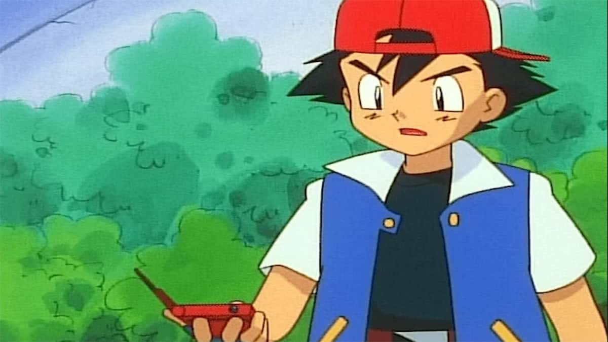 Ash holding a Pokedex