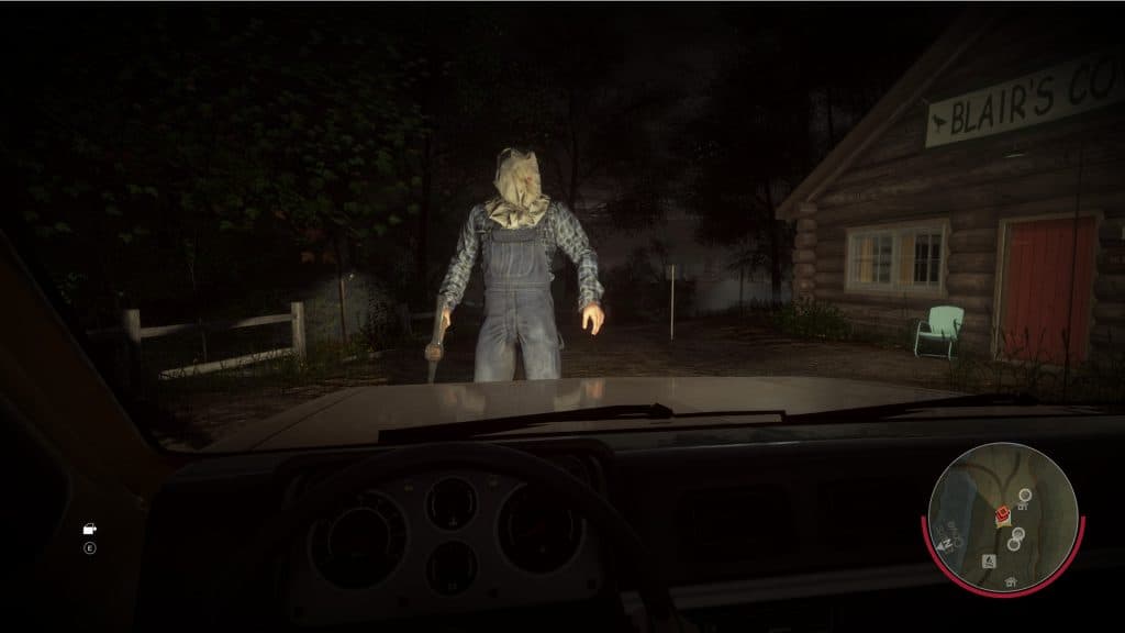 Screengrab of Friday the 13th featuring Part 2 Jason standing in front of a car.