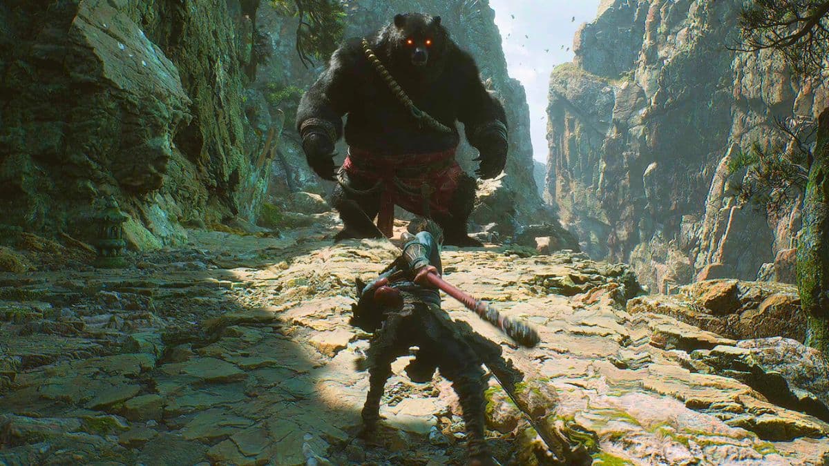 the monkey king facing a bear in black myth: wukong